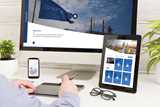 Elearning displayed on screen, tablet and mobile phone.