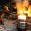 worker in a foundry casting a metal workpiece