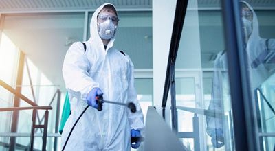 Shot of male person in white chemical protection suit doing disinfection of public areas to stop spreading highly contagious corona virus. Nouryon’s Triameen® Y12D is a highly effective biocidal amine with broad spectrum microbiocidal properties. It's excellent for use against Coronavirus, Mycobacteria and Pseudomonas aeruginosa, Influenza virus H1N1.