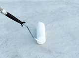 Paint roller. Cool roof coatings - The Future of Urban Cooling  Keeping buildings cooler in an innovative and more sustainable way