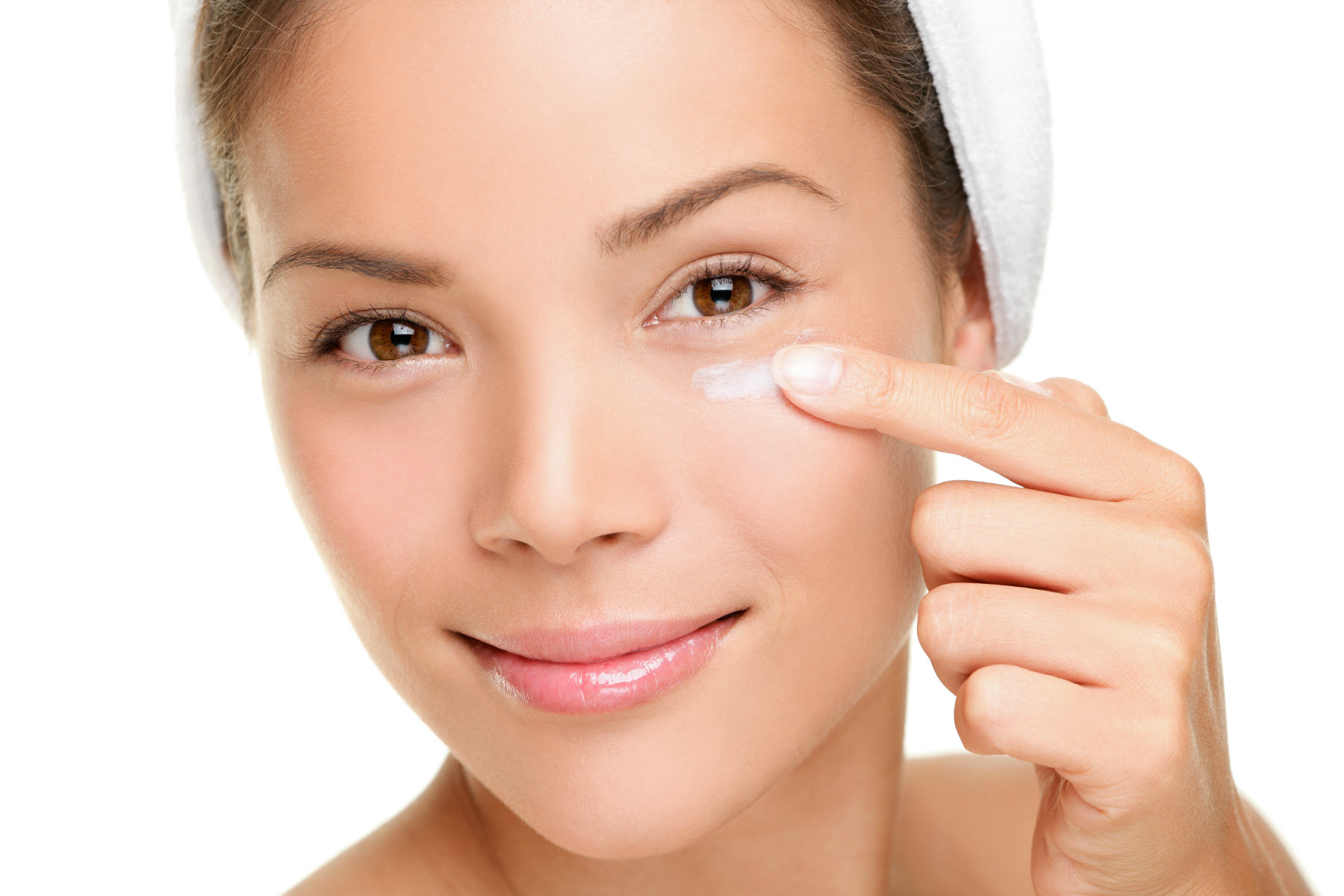 Woman applying facecream 