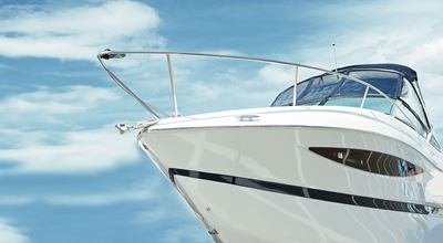 A close-up view of the front of a white yacht