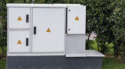 Outdoor plastic control cabinet with warning signs