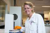 Scientist using a DSC instrument—demonstrating thermal analysis in a lab setting.