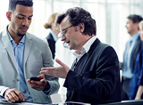 Two men discussing ethical business behavior and sourcing