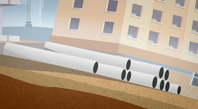 Vector image of large pvc pipes stacked on the ground at a construction site near a beige building.